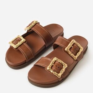SCHUTZ Brown Leather Slide Sandals with Gold Buckles